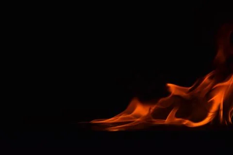 Fire flames on black background Stock Photos