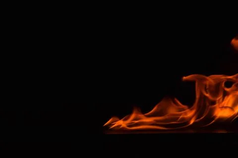 Fire flames on black background Stock Photos