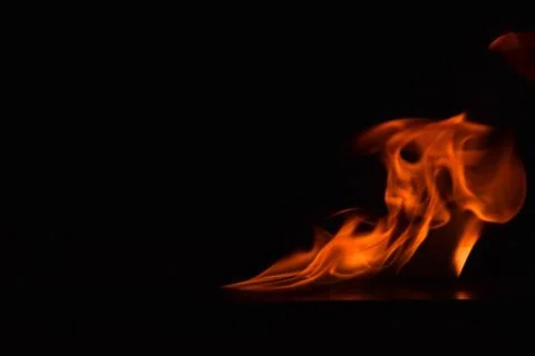 Fire flames on black background Stock Photos