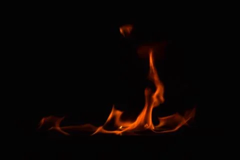 Fire flames on black background Stock Photos