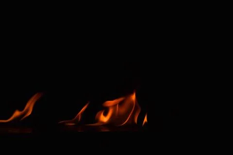 Fire flames on black background Stock Photos