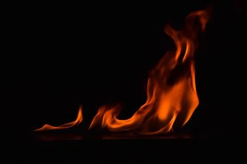 Fire flames on black background Stock Photos