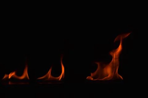 Fire flames on black background Stock Photos
