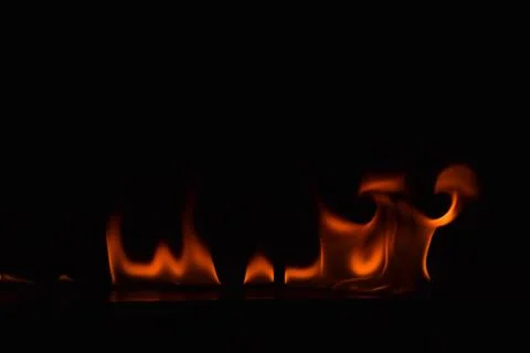 Fire flames on black background Stock Photos