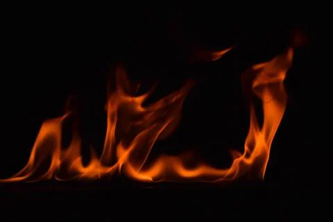 Fire flames on black background Stock Photos