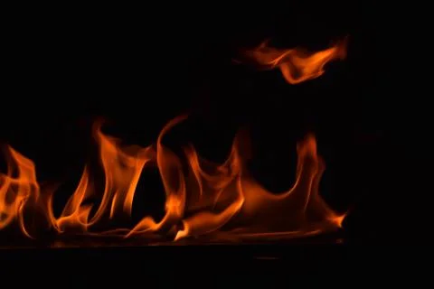 Fire flames on black background Stock Photos