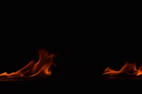 Fire flames on black background Stock Photos
