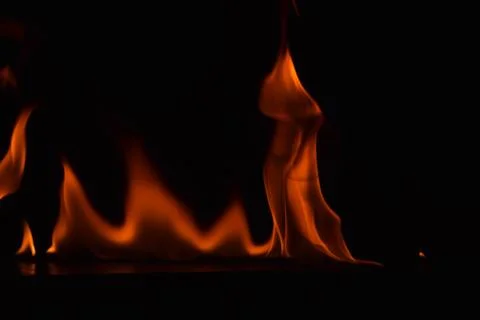 Fire flames on black background Stock Photos