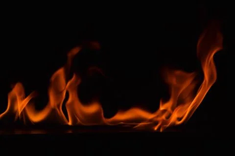 Fire flames on black background Stock Photos