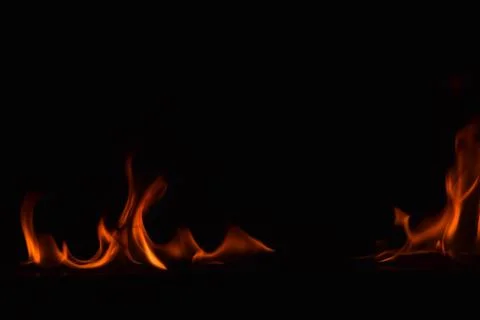 Fire flames on black background Stock Photos