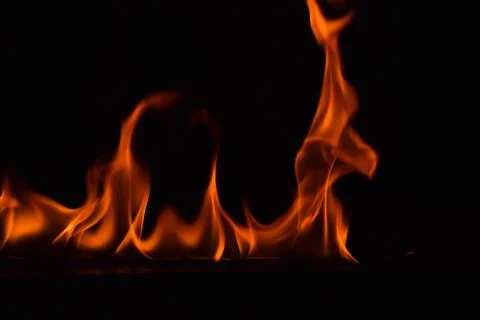 Fire flames on black background Stock Photos