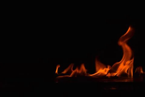 Fire flames on black background Stock Photos