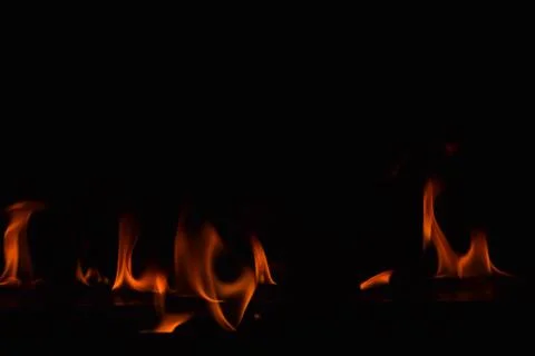 Fire flames on black background Stock Photos