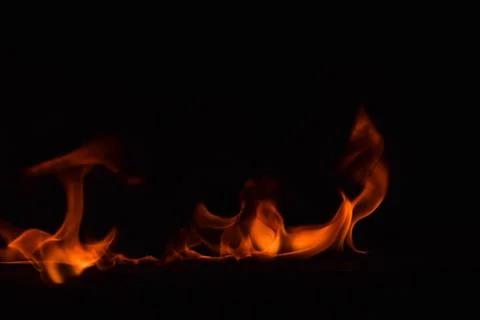 Fire flames on black background Stock Photos