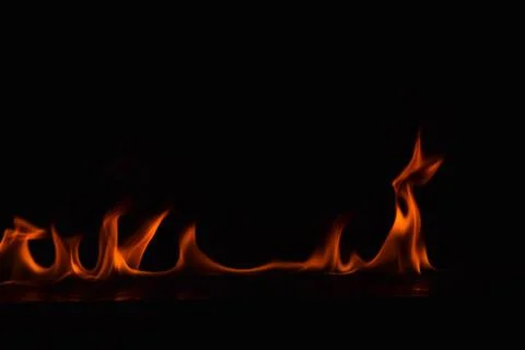 Fire flames on black background Stock Photos
