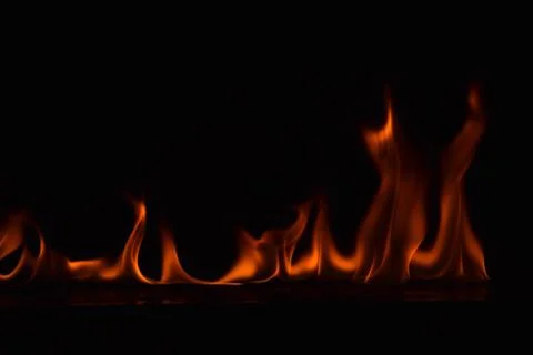 Fire flames on black background Stock Photos
