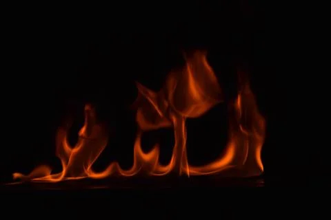 Fire flames on black background Stock Photos