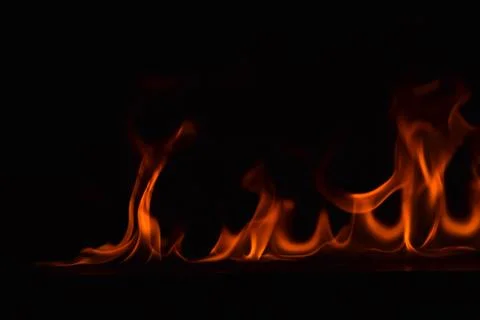 Fire flames on black background Stock Photos