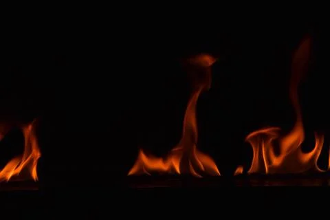 Fire flames on black background Stock Photos