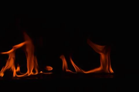 Fire flames on black background Stock Photos