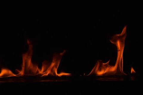 Fire flames on black background Stock Photos