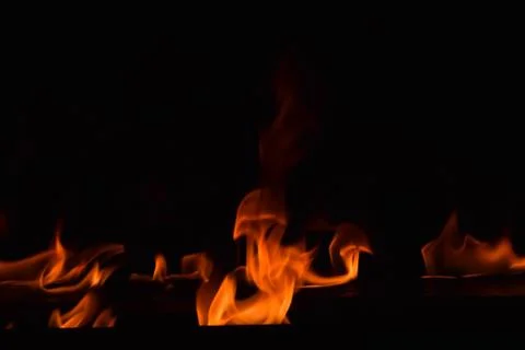 Fire flames on black background Stock Photos