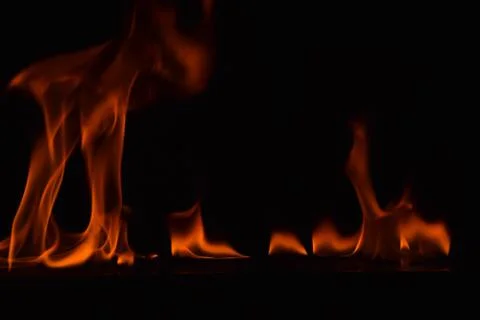 Fire flames on black background Stock Photos