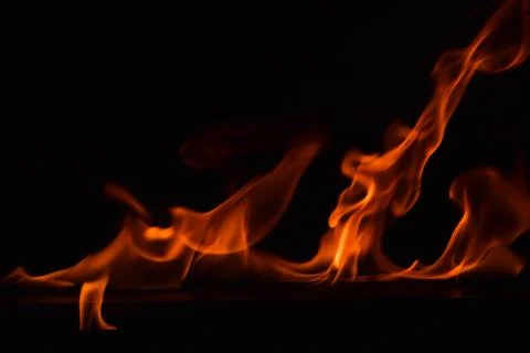 Fire flames on black background Stock Photos