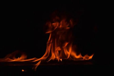 Fire flames on black background Stock Photos