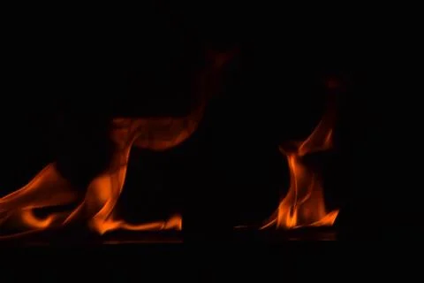 Fire flames on black background Stock Photos