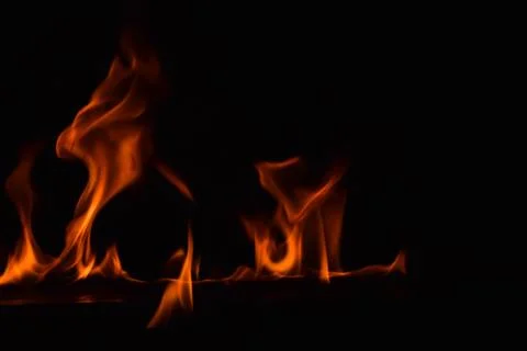 Fire flames on black background Stock Photos