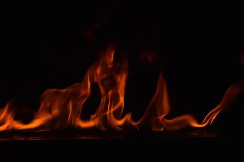 Fire flames on black background Stock Photos