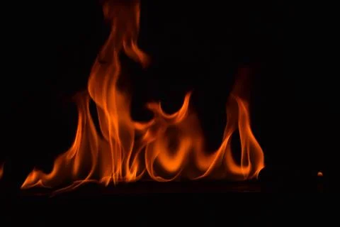 Fire flames on black background Stock Photos