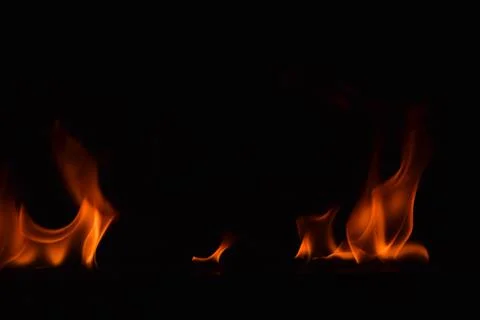 Fire flames on black background Stock Photos