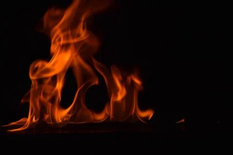 Fire flames on black background Stock Photos