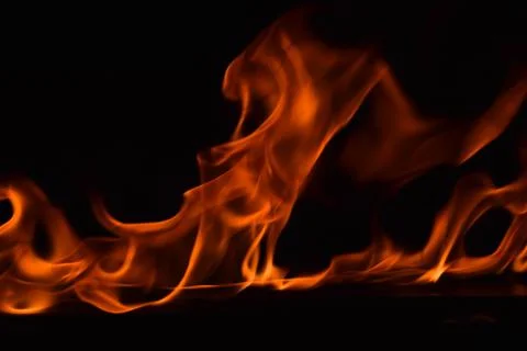 Fire flames on black background Stock Photos