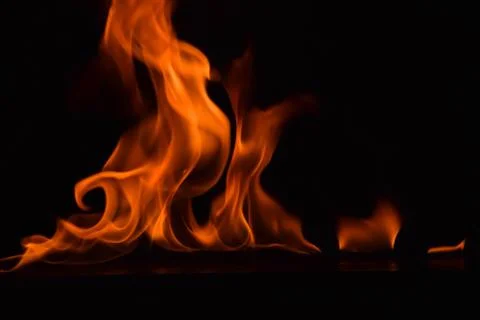 Fire flames on black background Stock Photos