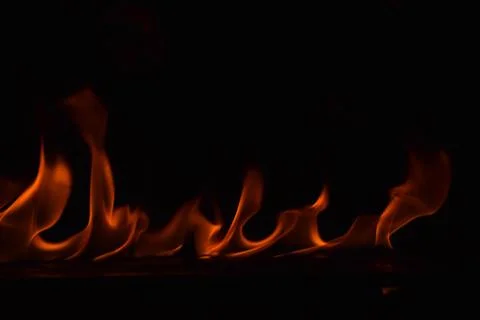 Fire flames on black background Stock Photos