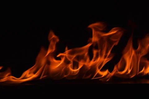 Fire flames on black background Stock Photos