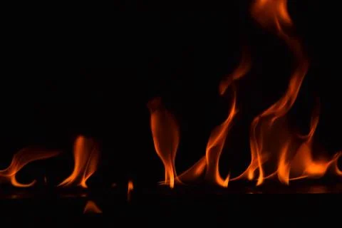 Fire flames on black background Stock Photos