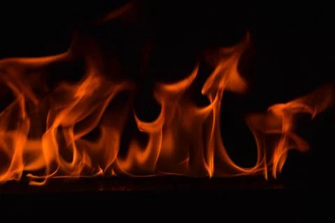 Fire flames on black background Stock Photos