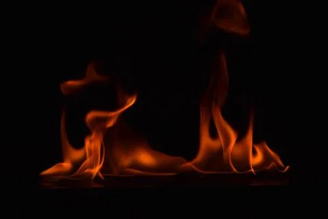 Fire flames on black background Stock Photos
