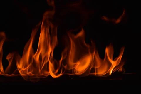 Fire flames on black background Stock Photos