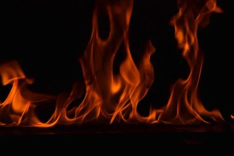 Fire flames on black background Stock Photos