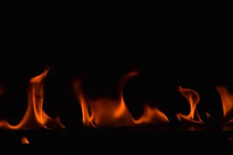 Fire flames on black background Stock Photos