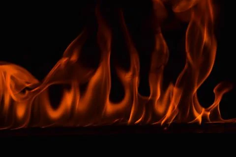 Fire flames on black background Stock Photos