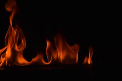 Fire flames on black background Stock Photos