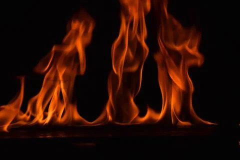 Fire flames on black background Stock Photos