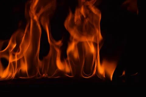 Fire flames on black background Stock Photos