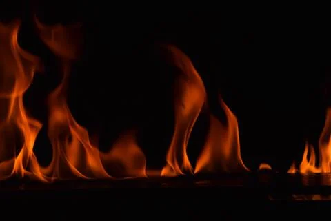 Fire flames on black background Stock Photos